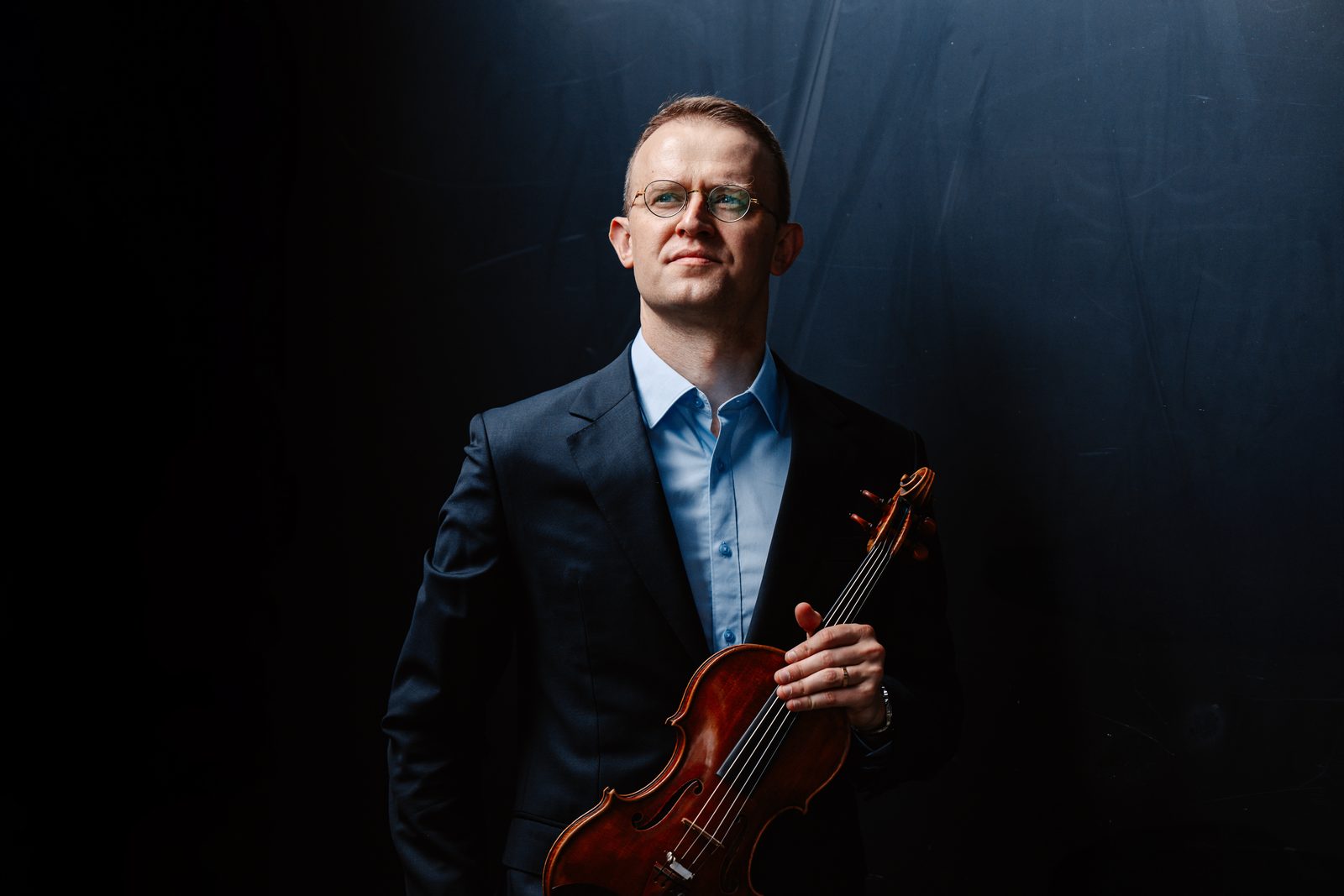 David Southorn, studio portrait holding his violin