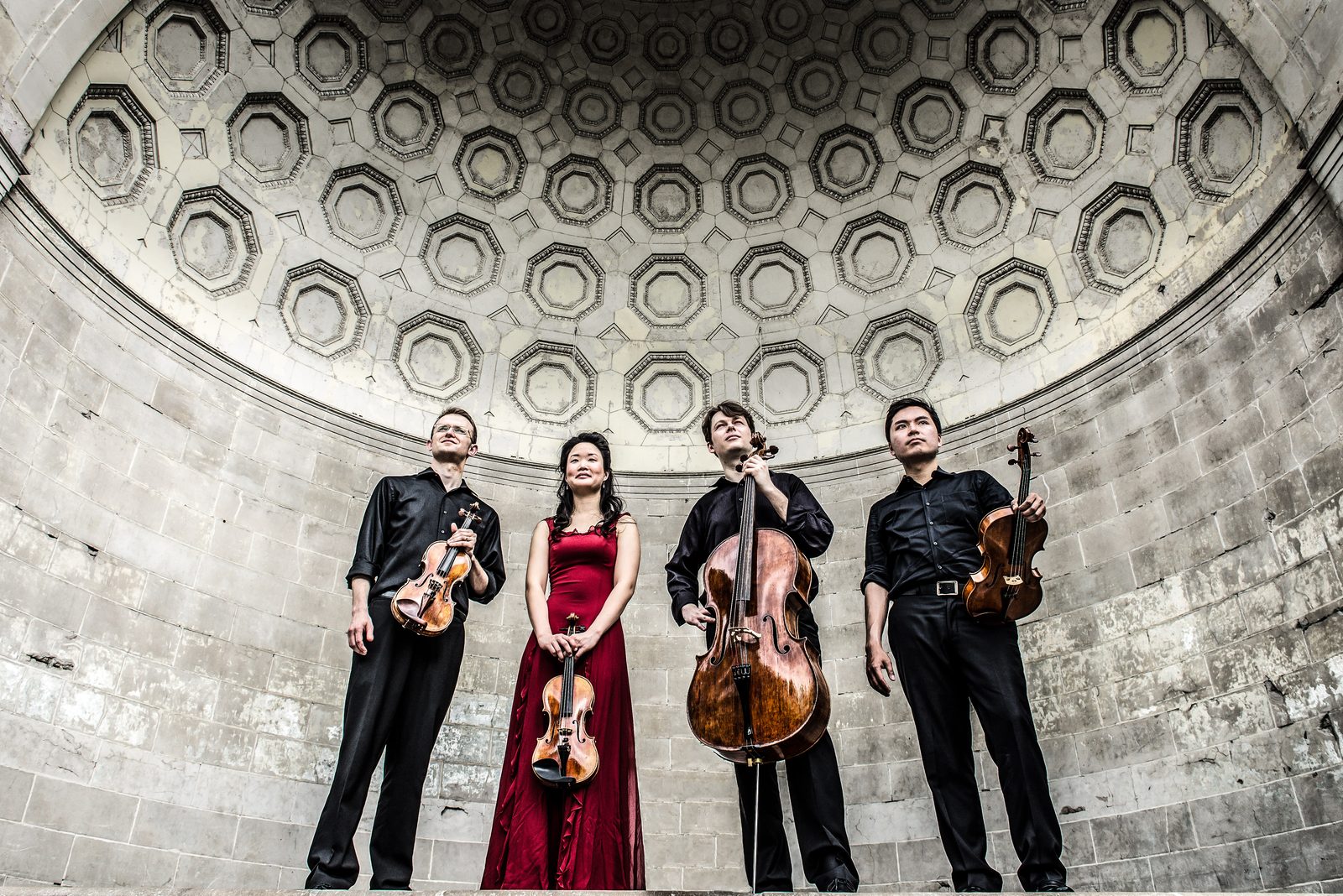 Four musicians, including David Southorn, under an ornate domed ceiling