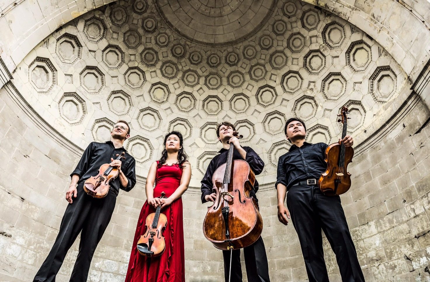 Four musicians, including David Southorn, under an ornate domed ceiling